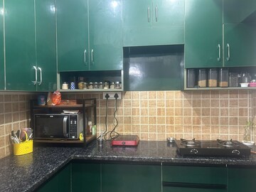 Kitchen in 2.5 BHK Apartment at Mahagun Mywoods, Sector 16c Greater Noida – for Rent