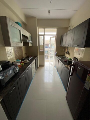 Kitchen in 4 BHK Apartment at Prateek Laurel, Sector 120 – for Rent
