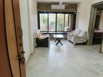 Living Room in 2 BHK Apartment at Juhu Darshan CHS, Andheri West – for Rent