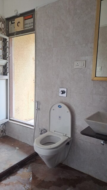 Bathroom in 2 BHK Apartment at Nilgiri Upvan CHS, Gawand Baug – for Rent
