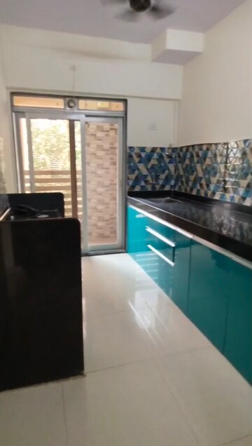 Kitchen in 1 BHK Apartment at Cosmos Orchid, Ghodbunder Road – for Rent