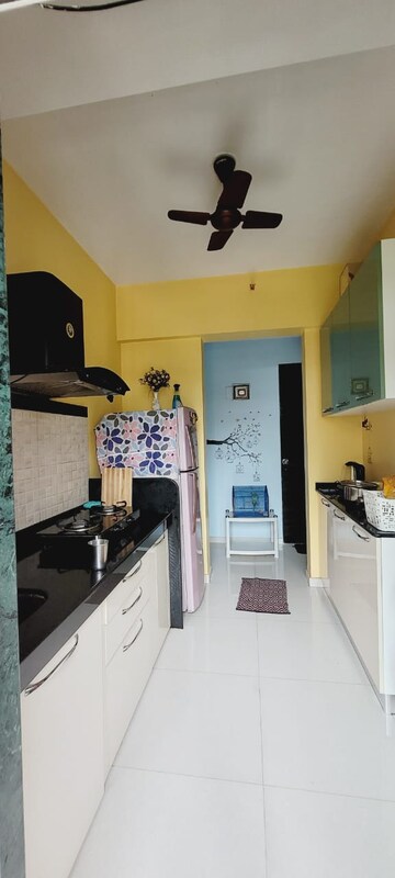 Kitchen in 1 BHK Apartment at Mahavir Kalpavruksha, Ghodbunder Road – for Rent