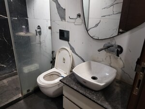 Bathroom in 3 BHK Builder Floor at Rajouri Garden – for Sale