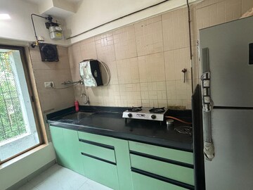 Kitchen in 1 BHK Apartment at Raunak Delight, Owale – for Rent