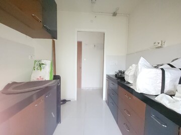 Kitchen in 1.5 BHK Apartment at Godrej Emerald, Ghodbunder Road – for Rent