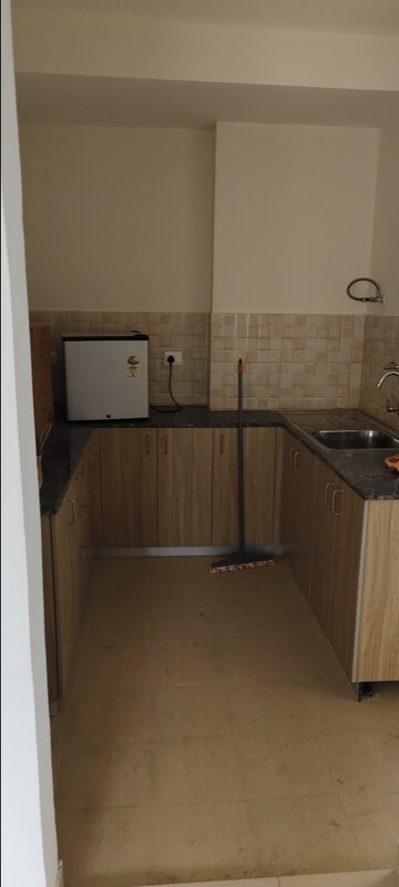 Kitchen in 3 BHK Apartment at Amrapali Crystal Homes, Sector 76 – for Rent