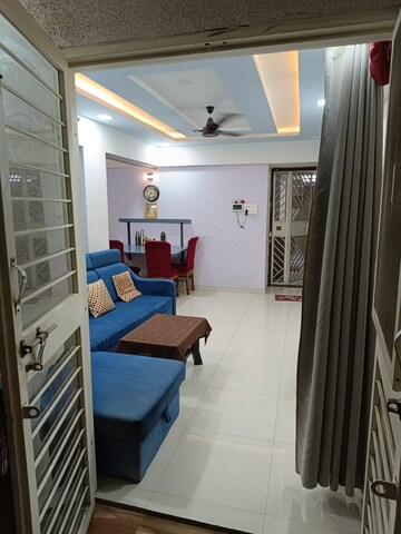 Living Room in 2 BHK Apartment at Charholi Budruk – for Rent