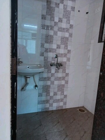 Bathroom in 1 BHK Apartment at Dharti Orange Heights, Morya Nagar – for Sale