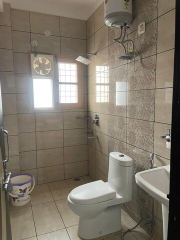 Bathroom in 3 BHK Apartment at Eros Cliffton Apartments, Charmwood Village – for Rent