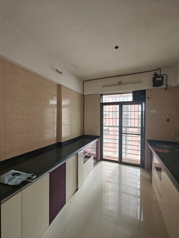 Kitchen in 3 BHK Apartment at Nilkamal CHS Nerul, Nerul – for Rent