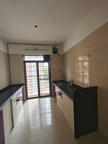 Kitchen in 3 BHK Apartment at Nilkamal CHS Nerul, Nerul – for Rent