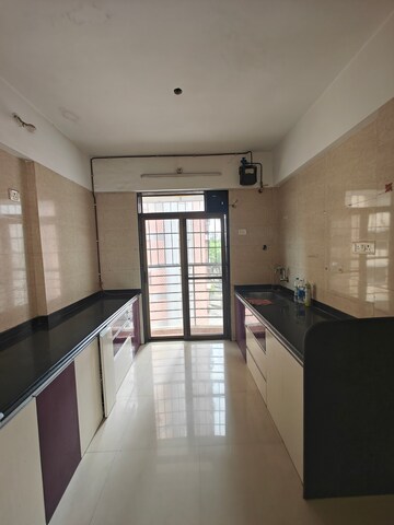 Kitchen in 3 BHK Apartment at Nilkamal CHS Nerul, Nerul – for Rent