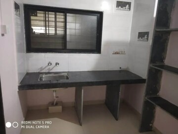 Kitchen in 1 BHK Apartment at Rupali Palace, Wadgaon Sheri – for Rent