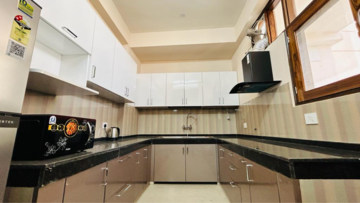Kitchen in 4 BHK Apartment at The 4 Aces CHS, Sector 27 – for Rent