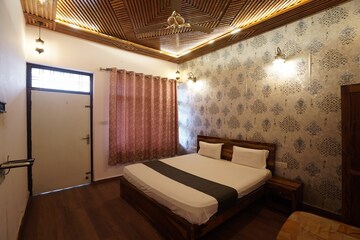 Bedroom in 4 BHK Apartment at Trimurtys Kachnar, C-Scheme – for Rent