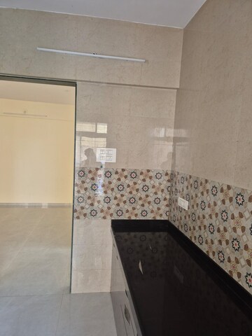 Kitchen in 2 BHK Apartment at Gaurang Tulsi Vrindavan CHS, Naupada – for Rent