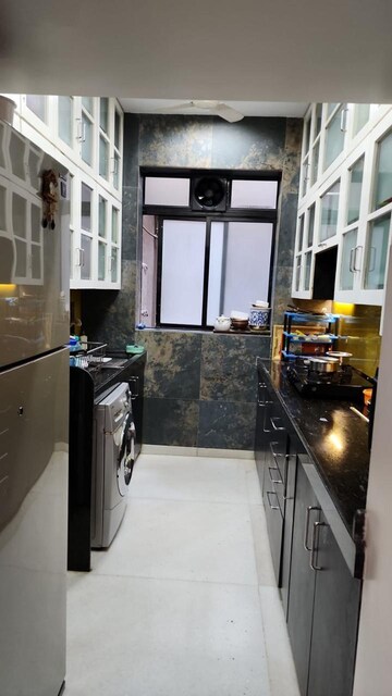 Kitchen in 2 BHK Apartment at Shyam Niwas CHS, Cumbala Hill – for Sale
