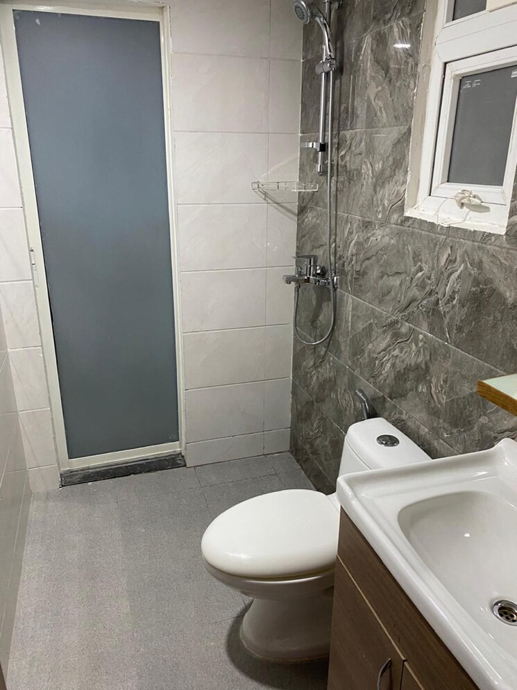 Bathroom, tulip-yellow 3 Bedroom 1034 Sq.Ft. Apartment In Sector 69 Gurgaon 9077755