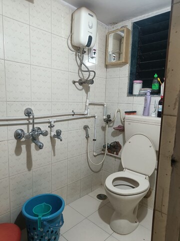 Bathroom in 1 BHK Apartment at Shreeji Tower, Panchsheel Nagar – for Rent