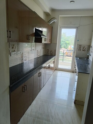 Kitchen in 3 BHK Builder Floor at Ansal API Esencia, Sector 67 – for Rent