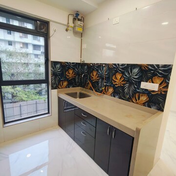 Kitchen in 1 BHK Apartment at Gurukrupa Divyam, Naidu Colony – for Sale