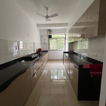 Kitchen in 3 BHK Apartment at Rupji Gulmohar, Jeevan Nagar – for Rent