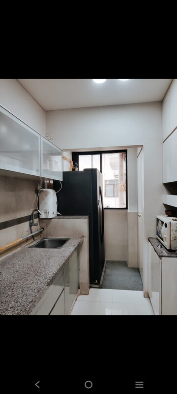 Kitchen in 3 BHK Apartment at Shivalik Sharda Park View, Shela – for Rent