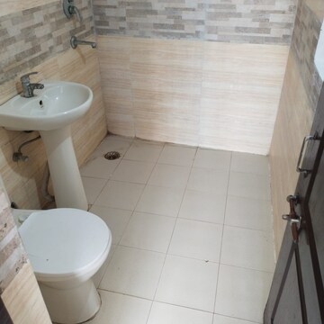 Bathroom in 2.5 BHK Apartment at Amrapali Zodiac, Sector 120 – for Sale
