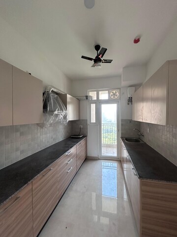 Kitchen in 3.5 BHK Apartment at ATS Homekraft Pious Hideaways, Sector 150 – for Rent