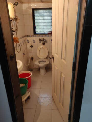 Bathroom in 2 BHK Apartment at Parvati Nagar CHS, Andheri West – for Sale