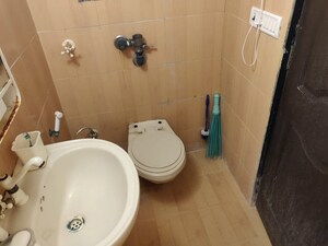 Bathroom in 2 BHK Apartment at Parvati Nagar CHS, Andheri West – for Sale