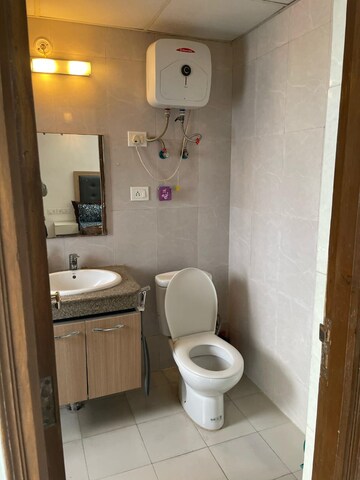 Bathroom in 1 BHK Apartment at Nimbus The Golden Palm, Sector 168 – for Rent