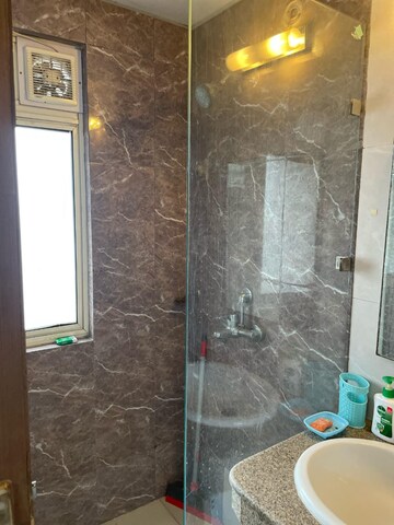 Bathroom in 1 BHK Apartment at Nimbus The Golden Palm, Sector 168 – for Rent