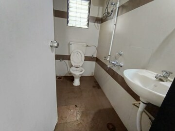 Bathroom in 2 BHK Apartment at Shree Manibhadra Swapna Sankul, Rahatani – for Rent