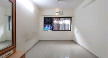 Bedroom in 1 BHK Apartment at Sonal Link Residency, Malad West – for Rent