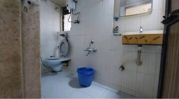 Bathroom in 1 BHK Apartment at Sonal Link Residency, Malad West – for Rent