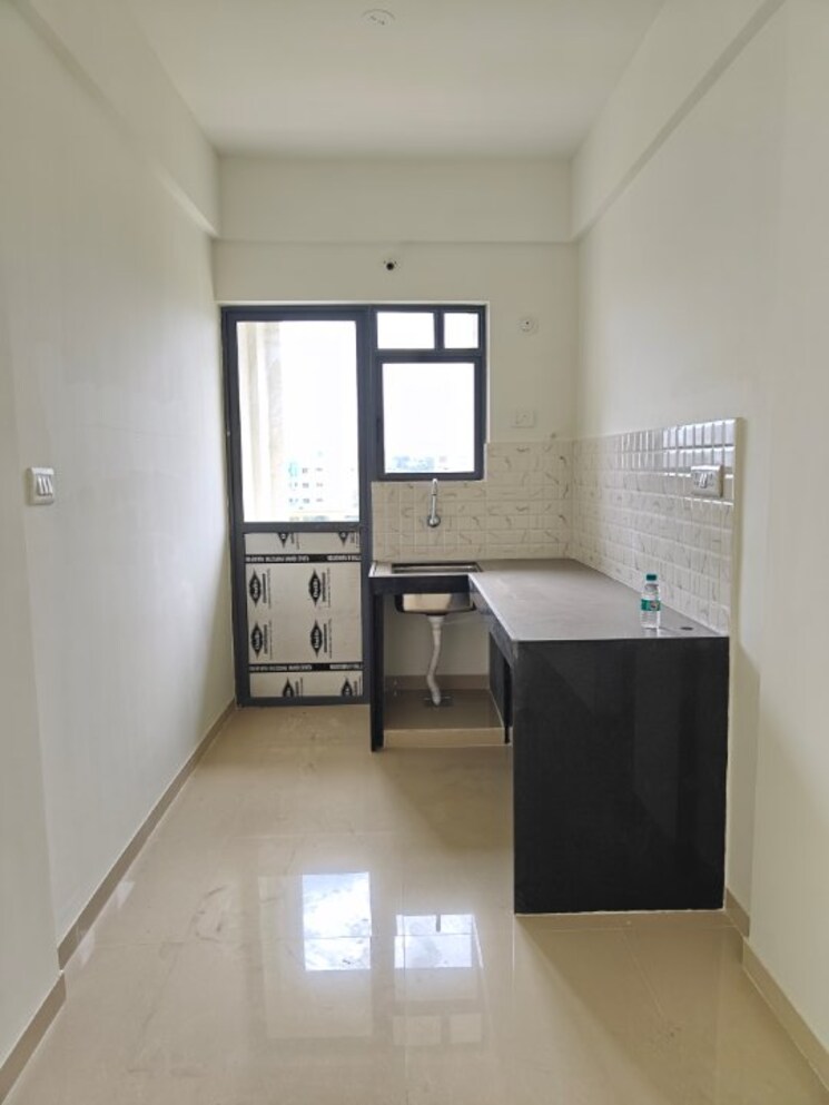 Kitchen, peninsula-address-one 2 Bedroom 586 Sq.Ft. Apartment In Gahunje Pune 9082383