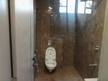 Bathroom in 3 BHK Apartment at Raja Park – for Rent