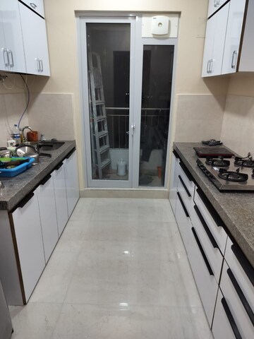 Kitchen in 2 BHK Apartment at Piramal Vaikunth, Balkum Pada – for Rent