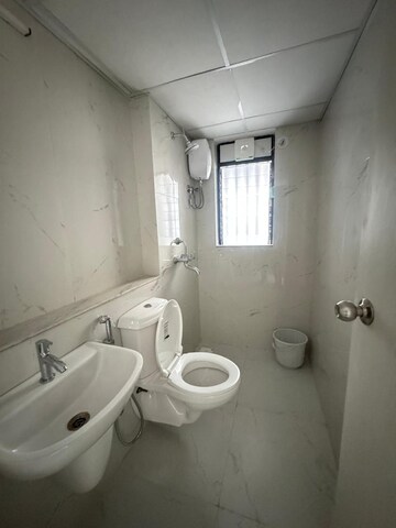 Bathroom in 1 BHK Apartment at Runwal Gardens, Dombivli East – for Rent