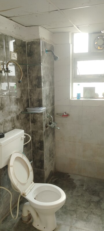 Bathroom in 1 BHK Apartment at Auric City Homes, Sector 82 – for Rent