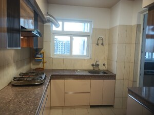Kitchen in 4 BHK Apartment at 3C Lotus Panache, Sector 110 – for Rent