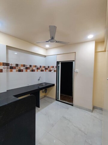 Kitchen in 2 BHK Apartment at Spring Glory Co-Operative Society, Kharadi – for Rent
