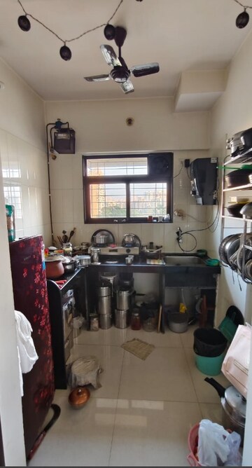 Kitchen in 1 BHK Apartment at Raunak Delight, Owale – for Sale