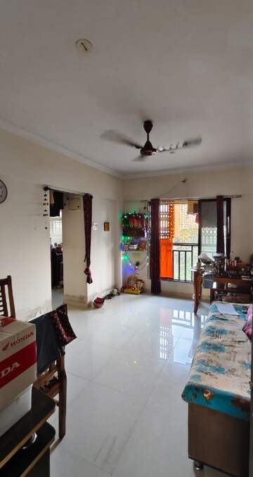 Living Room in 1 BHK Apartment at Raunak Delight, Owale – for Sale