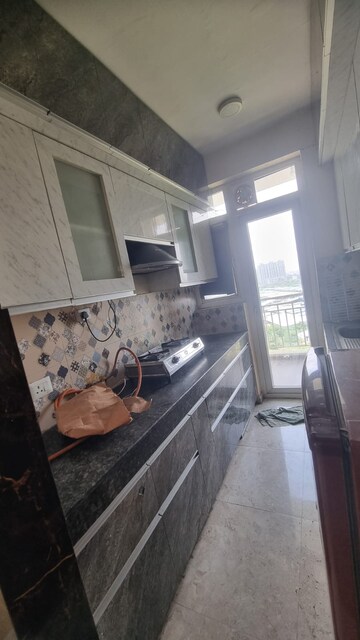 Kitchen in 2 BHK Apartment at Panchsheel Pinnacle, Sector 16 Greater Noida – for Rent