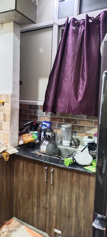 Kitchen in 2 BHK Apartment at Mahagun Mywoods, Sector 16c Greater Noida – for Rent