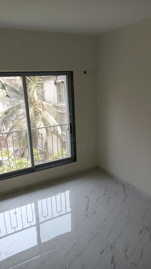 Room in 2 BHK Apartment at Prerana CHS, Borivali West – for Sale