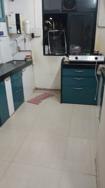 Kitchen in 1 BHK Apartment at Unnathi Woods Phase 1 And 2, Ghodbunder Road – for Rent