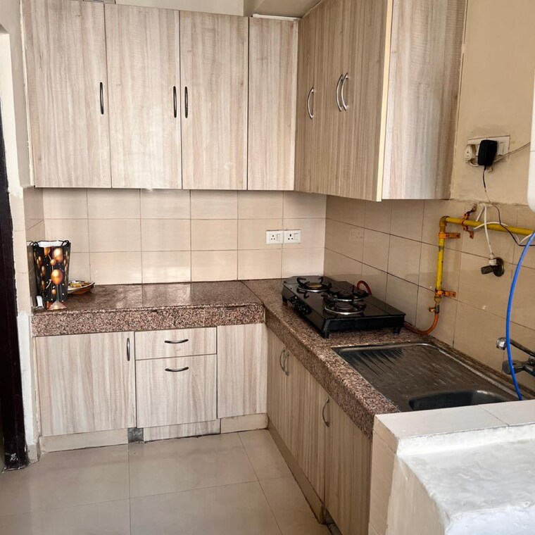 Kitchen, logix-blossom-greens 2 Bedroom 903 Sq.Ft. Apartment In Sector 143 Noida 9086316